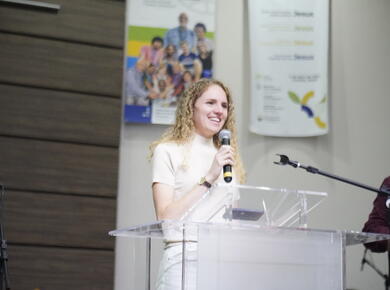 Valentina Kunze, chair of the YABs committee, shares a testimony at Renewal 2024 in Curitiba, Brazil