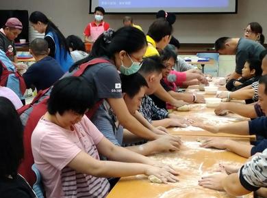 <p>New Dawn caregivers and clients make dumplings. Photo supplied by New Dawn</p>