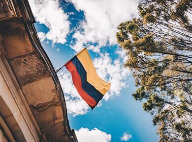 Colombian flag against blue sky