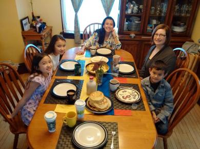 <p>Natalia and her host family, ready to try the Colombian breakfast. Photo: Vinh Huynh.</p>