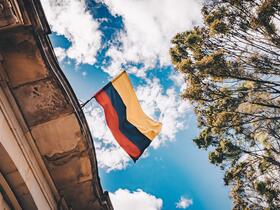 Colombian flag against blue sky